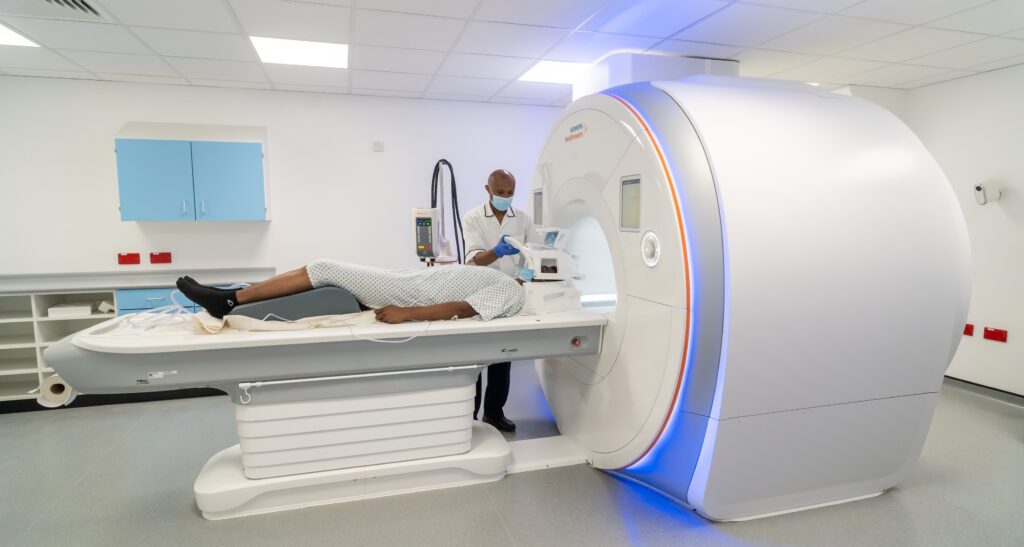 Doctor and patient using a MRI scanner