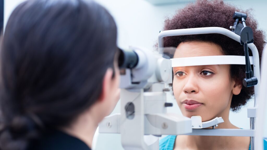 Doctor and female patient doing an eye test