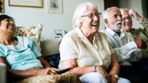 Older people sat down on a sofa