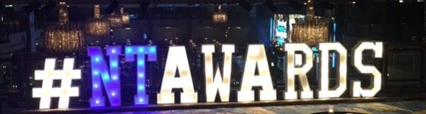 Nursing Times Awards hashtagNTAwards is shown spelled out in lights