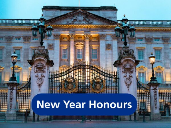 New Year Honours (in white text on blue), with the gates of Buckingham Palace showing in the background